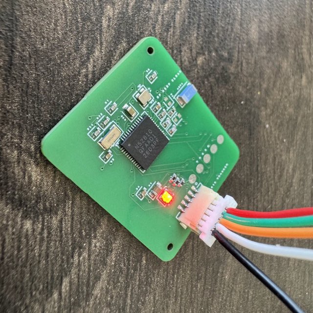 Powered nRF52810 Bluetooth board with its LED lit